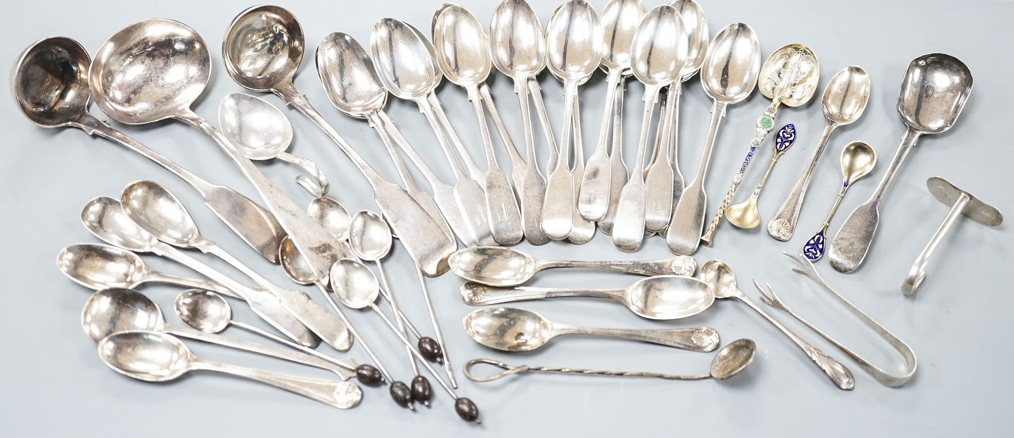 A set of twelve Victorian silver fiddle pattern teaspoons, London, 1870, a pair of Victorian sauce lades and a quantity of assorted sundry silver flatware